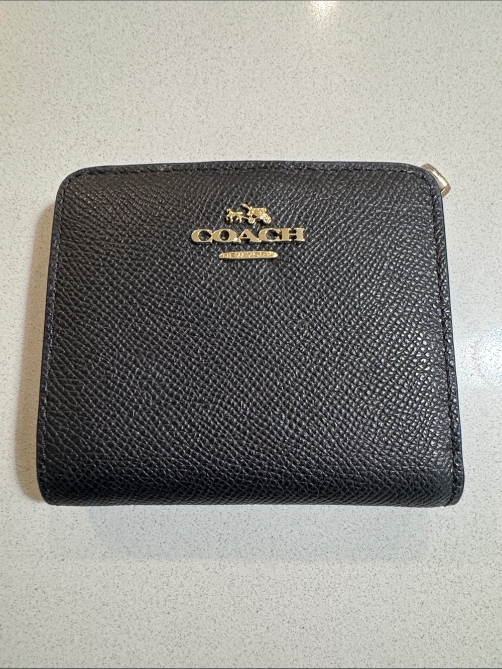 Coach Black Pebbled Leather Small wallet. Gold accents